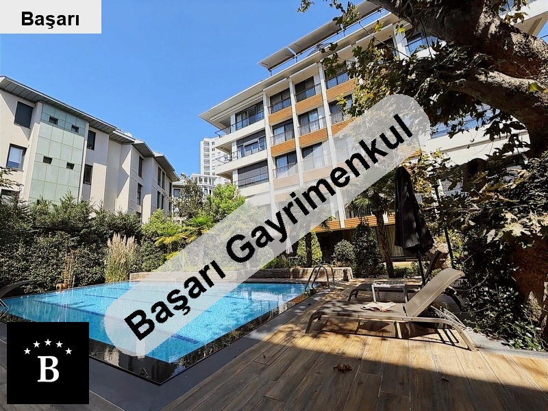 Başarı'dan  sahi̇l'de 105m2 3+1 bahçeli̇ havuzlu satilik dai̇re