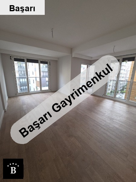 Başarı'dan  sahi̇lde sifir bi̇nada balkonlu lüx