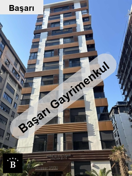Başarı'dan  sahi̇l 2 yaşinda 48m2 net 8 ara kat 1+1
